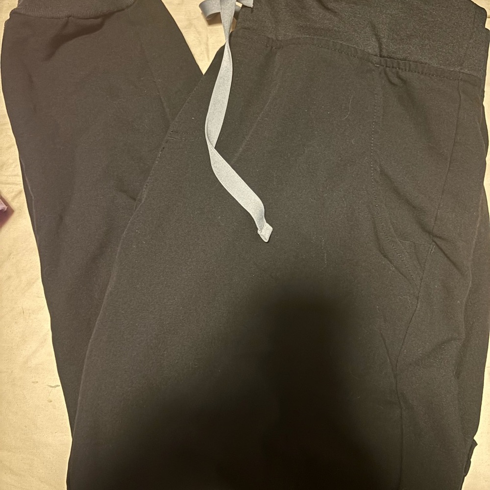 Size medium, color black, figs scrub jacket, scrub top, and scrubs pants combo.